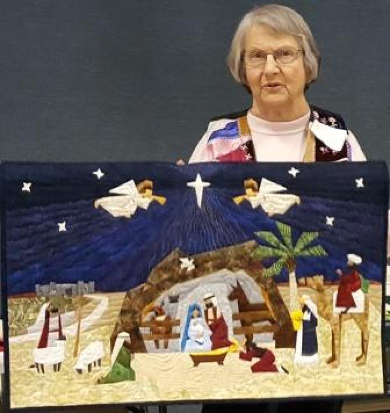 Eileen shows a Nativity quilt she got done for this past Christmas